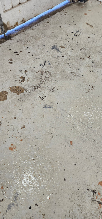 Coo-Var Oil Remover used on a garage floor with oil stains removed.