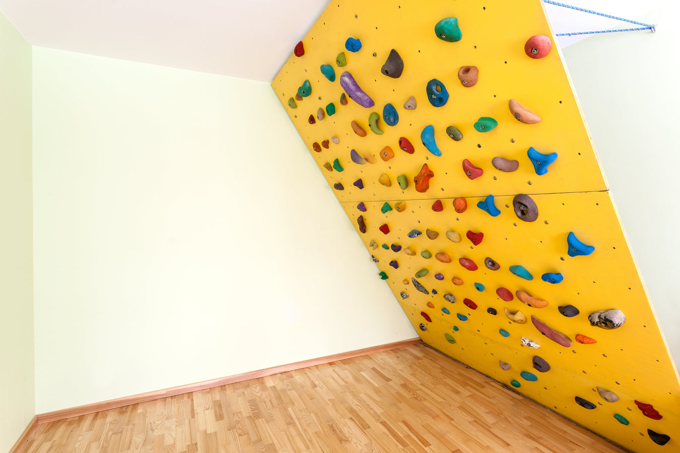 Home DIY Climbing Wall Painted with Coo-Var Rock City Climbing Wall Paint in Yellow