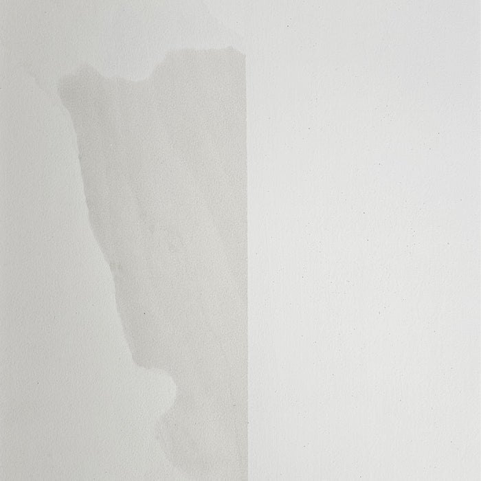 This image illustrates the remarkable coverage provided by SPO Shellac Stain & Odour Blocker on a coffee stain. One side remains untreated, clearly showing how the stain bleeds through the topcoat, while the treated side demonstrates a clean finish, with the coffee stain effectively sealed and concealed.